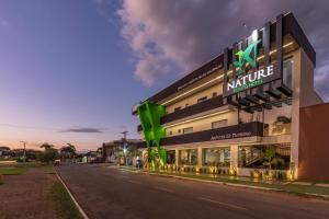a building with a kulture sign on the side of a street at Nature Bonito Hotel in Bonito