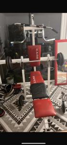 a red chair sitting in front of a gym at Chambre avec vue panoramique in Cachan