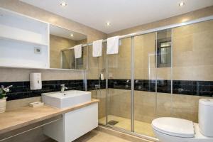 a bathroom with a toilet and a sink and a shower at Hotel Butua Residence in Budva