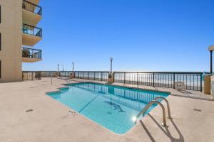a swimming pool on the side of a building at Oceanfront 1BR Condo with Corner Balcony Pool in Myrtle Beach