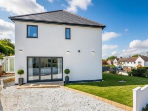 a white house with a yard at Dreghorn House 5 b-rooms 9 beds 3 toilets 2 showers,1 bath 2 receiption Secure free Parking 233 Wifi in Edinburgh