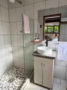 a bathroom with a sink and a shower at Casa de Campo in Rurrenabaque +31 photos