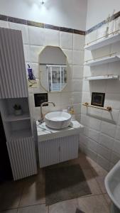 a bathroom with a sink and a mirror at Casa India in Assemini