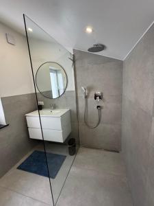 a bathroom with a sink and a mirror at Melem Apartments 2 in Langen