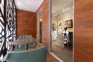 a dining room with a table and a chair at Luxury Condo in central location in Playa del Carmen