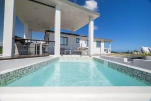 a swimming pool in front of a house at Vista Serena in Salinas