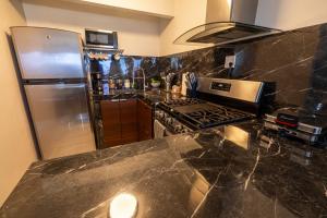 a kitchen with a stove and a refrigerator at Vista Serena in Salinas