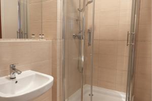 a bathroom with a sink and a shower at Przystanek Słupno, 5 km od Płock in Słupno +21 photos