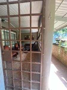 an open door into a room with a table at Pumila House in Villa Rosario