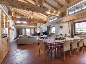 a kitchen and living room with a table and chairs at Luxury Central Kirchberg in Kirchberg in Tirol