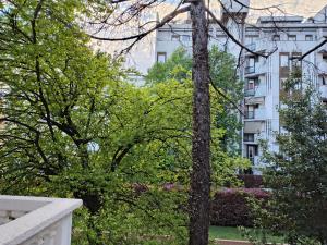 a view from the balcony of a building with trees at Lacasabianca guest house saronno in Saronno