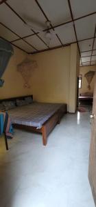 a large room with a bed in the middle of it at Lavanya Holiday Resort Kataragama in Kataragama