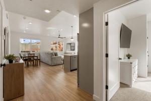a living room with a kitchen and a dining room at Ohana Nest condo in Hurricane