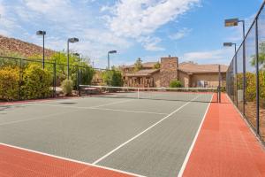 a tennis court in a house with at Ohana Nest condo in Hurricane