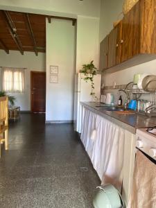 a kitchen with a sink and a counter top at Casa Josefa Cafayate in Cafayate
