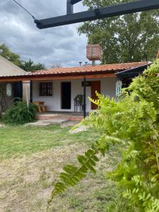 a small white house with a red roof at Casa Josefa Cafayate in Cafayate
