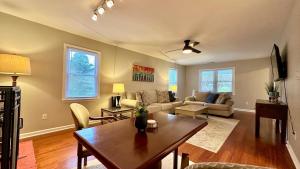 a living room with a couch and a table at 2200SQFT Coastal home on half Acre in Jacksonville