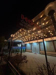 a building with lights on it at night at Old Bazar in Kogon