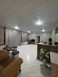 a large living room with a couch and a table at Old Bazar in Kogon