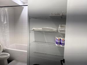 a bathroom with a toilet and a bath tub at 5 Star Suite with Free Parking and Easy Access to Downtown in Calgary +23 photos