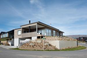 a house on the side of a road at McNeil Luxury Studio in Wanaka