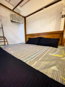 a bed in the back of a boat at Madu Villa in Weligama