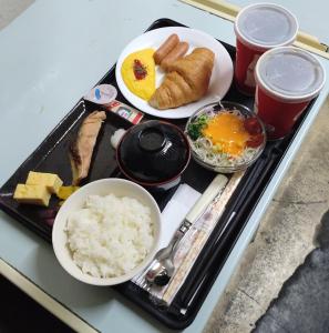 a tray of food with rice and eggs on a table at PrincessPrincessAzumino in Azumino