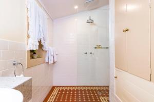 a bathroom with a shower and a sink at Winery Cottage in Tanunda +13 photos