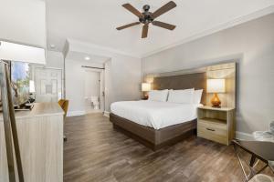 a bedroom with a bed and a ceiling fan at The Ridges Resort on Lake Chatuge in Young Harris
