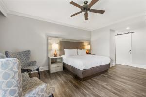 a bedroom with a bed and a ceiling fan at The Ridges Resort on Lake Chatuge in Young Harris