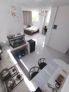 an aerial view of a kitchen and living room with a stove at Galápagos Apartments in Puerto Ayora