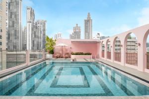 a swimming pool on the roof of a building at Away Bangkok Sukhumvit in Bangkok +59 photos