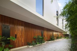 a hallway of a building with plants on the side at Echo Beach Villas 6 in Canggu