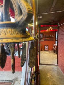a close up of a bell in a restaurant at Rato Ghar Hotel and Rooftop Restaurant in Bhaktapur