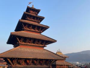 a close up of the top of a tower at Rato Ghar Hotel and Rooftop Restaurant in Bhaktapur