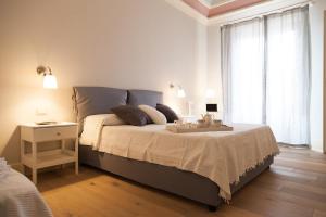 A bed or beds in a room at Il Leone Blu
