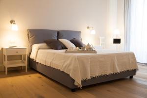 A bed or beds in a room at Il Leone Blu