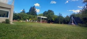 a yard with a gazebo and a playground at Casa con pileta San Luis Juana Koslay in Juana Koslay 