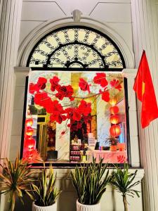 a store window with red decorations in a store at A In Hotel Atistar in Ho Chi Minh City