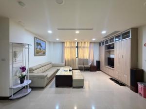 a living room with a couch and a table at Frank B&B in Jincheng