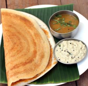 a plate of food with chapati and a bowl of dip at Puthooram Veedu in Chakkarakkal +12 photos
