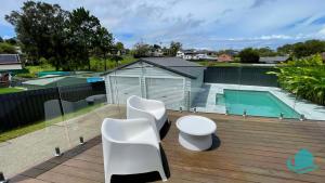 a deck with a toilet and a swimming pool at Casa Calvi - Central location with Pool in Jewells Station