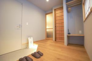 a living room with a pair of shoes on the floor at ミツカビルヂング in Kofu +13 photos