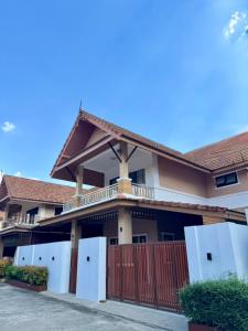 a house with a gate and a fence at Poonsiri Private Pool Villa Aonang in Ao Nang Beach