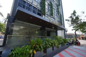a building with plants in front of it at Avenue A boutique hotel in Vijayawāda