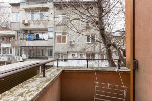 a balcony with a view of a building at Central 2BR - Workspace with Elevator in Varna City