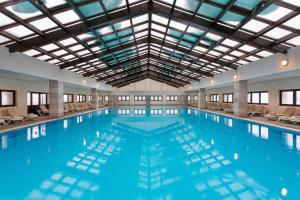 a large swimming pool with a large ceiling at Barida Hotels Davraz in Cobanisa
