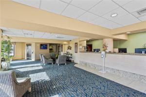 a lobby of a hospital with chairs and a counter at Luxury Beach front Condo in Galveston +13 photos