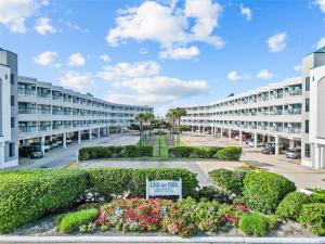 a view of the courtyard of a apartment building at Luxury Beach front Condo in Galveston