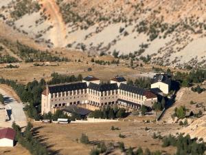 a large building in the middle of a mountain at Barida Hotels Davraz in Cobanisa